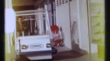Ottawa Canada (1967): Man Driving Golf Cart Down Sidewalk Next To Shop Then Man