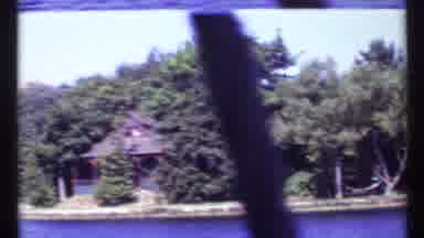Toronto Canada (1967): Boating Past A Cabin On An Island In The Middle Of A Lake