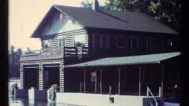Toronto Canada (1967): The Man Is Doing Something To His Home That Is On The Water