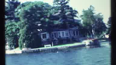 Toronto Canada (1967): Large Building On Waterfront Is Shown From Moving Boat On