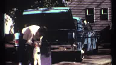 Toronto Canada (1967): Man With Cat In Front Of Open Trunk Of A Blue Classic Car
