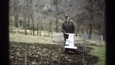 Minnesota-1970: View Of White Mille Lacs Lake Sign And Person Tilling Soil On A