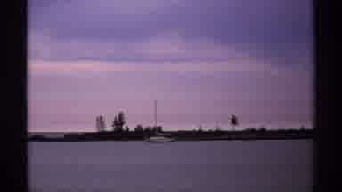Isle Royale Michigan (1971): Sail Boat Floating Near The Bank Of A Lake At Dusk
