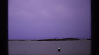 Isle Royale Michigan (1971): View Of Black Object In Ocean And Island With White