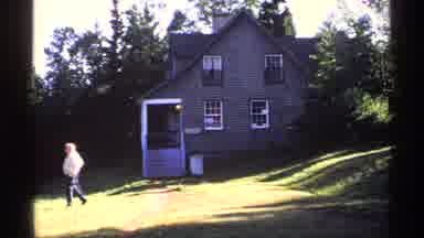 Isle Royale Michigan (1971): Man Walking Outside A House Labeled With A Sign That