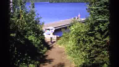 Isle Royale Michigan (1971): Man Stands By The Dock And Watches The Water And