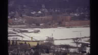 La Crosse Wisconsin (1971): Shot Of Building And Mountain Blanketed In Snow In The
