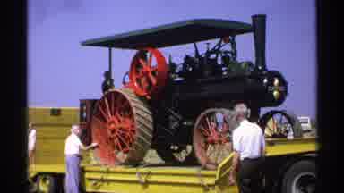 Minnesota (1971): Men Standing In Field With Tractor When Weather Is Nice