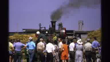 Minnesota (1971): Visitors In A Crowd At A Farm Watching Equipment Smoke And Work