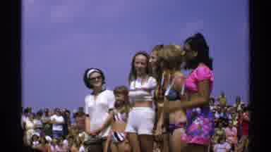 Minnesota (1971): Teenage Girls On Stage Surrounded By Crowd In An Open Space