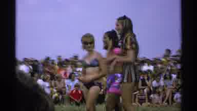 Minnesota (1971): Women Stand On Beach In Front Of A Crowd Image Flashes Of Two