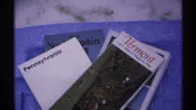 New York (1971): Different Pamphlets Representing Different States On A Table With