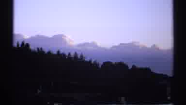 New York (1971): Static Shot Of Mountains And Blue Sky Behind Hill With Trees