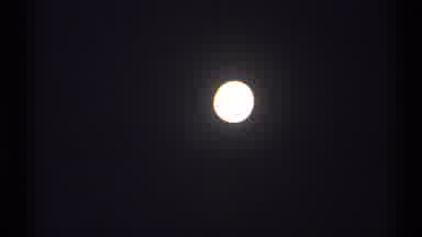 New York (1971): A Bright White Circle With A Black Background That Could Be A