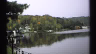 New York (1971): View Of A Calm Lake And Then A Road From A Car