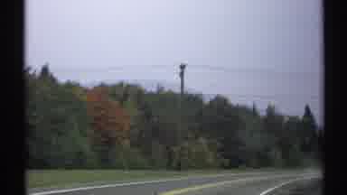 New York (1971): A Clean Road Filled With Trees And Mountains In View