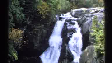 New York (1971): Waterfall Splitting In Between Rocks Into A Large Pool Of Water