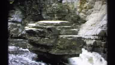 New York (1971): Waterfall Cascading Around Large Rock With Tree Near Canyon And