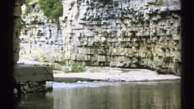 New York (1971): The Camera Shows A Tour Of Natural Rocky Walls On A River Side
