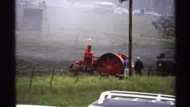 Rollag Minnesota (1971): A Red Tractor In A Field Followed By A Hand Painted