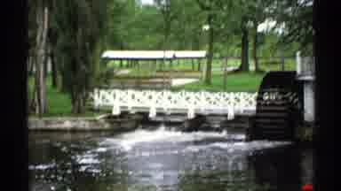 Rollag Minnesota (1971): Pedestrian Bridge Over Stream And Flower Garden In Bloom