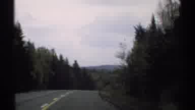 Vermont (1971): Driving Past The Canadian Pine Woods The Car Comes Across A French