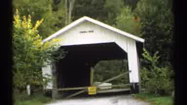 Vermont (1971): White Shed Surrounded By A Bunch Of Trees In Country