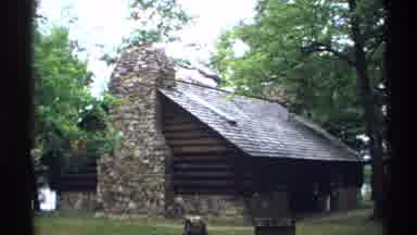 Wisconsin (1971): View Of Brown Log Building And Tan Brunet Island Sign On A Clear