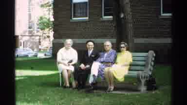 Wisconsin (1971): Elderly People Sitting On A Bench Looking At Camera