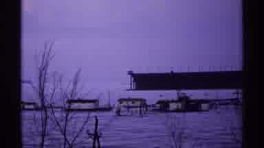Wisconsin (1971): A Snow-Covered Houses In A Rocky Mountain