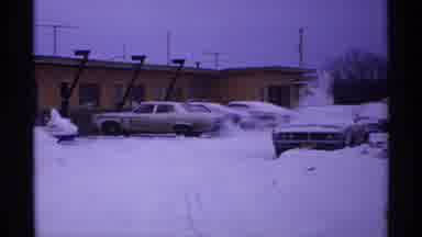 Wisconsin (1971): Piles Of Snow In The Parking Lot That Towers Of The Cars