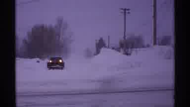 Wisconsin (1971): Snowy Road Car With Attached Plow Drives Down Snowy Road