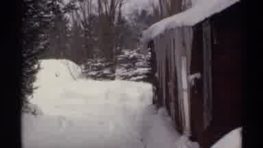 Wisconsin (1971): View Of Icicles Hanging From Brown Building On A Clear Winter