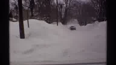 Wisconsin (1971): Snow Storm Aftermath With Deep Snow And A Person Shoveling