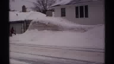 Wisconsin (1971): Snowstorm Forms Snow Mounds Outside Of A Home