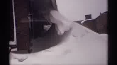 Wisconsin (1971): Snow Is Piled To The Top Of A House And Over A Vehicle During