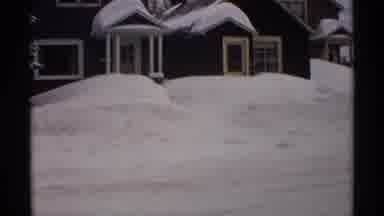 Wisconsin (1971): A Street Fully Set With Lots Of Huge Snow Mountains And House