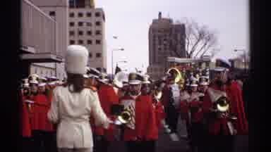 Wisconsin-1971: Drum Major Leads Band Marching In Front Of White And Gold Float