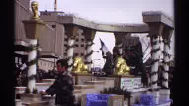 Wisconsin (1971): A Large Float In A Parade With Columns And People Dressed In