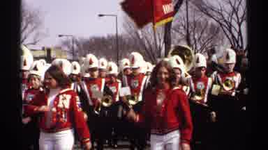 Wisconsin (1971): A Parade With A Marching Band Cheerleaders And A Snowman