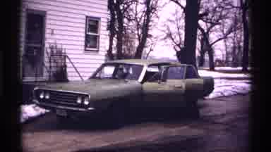 Wisconsin (1971): Man Gets Inside A Car
