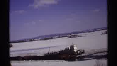Wisconsin (1971): Tugboat Moves Through Icy River On A Sunny Cold Day With Snow