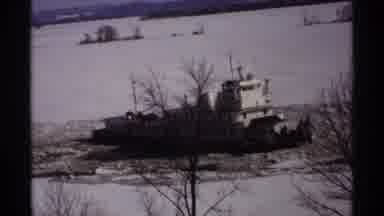 Wisconsin (1971): Small Ship Sailing On Ice Covered River Surrounded By Snow