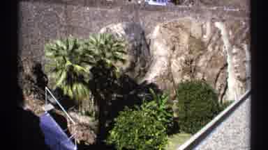 Arizona (1972): The Side Of A Dam Featuring Boulders Trees Shrubs A Walkway And A