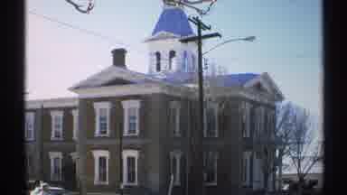 Arizona (1972): View Of Red Brick Building On A Bright Sunny Day