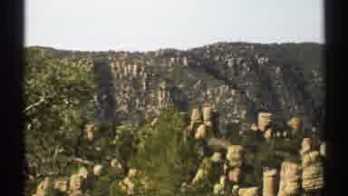 Arizona (1972): A Huge Mountains Were With Lots Of Rocks And Greens Shows The
