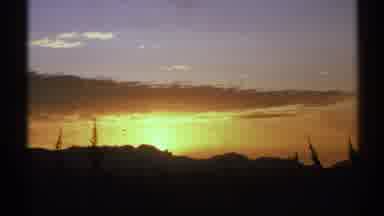 Arizona (1972): The Sun Setting Behind A Mountain