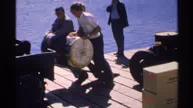 Isle Royale Michigan (1972): Men Moving A Barrel On A Boat