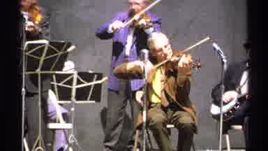 Isle Royale Michigan (1972): People A Stage Playing String Instruments Together