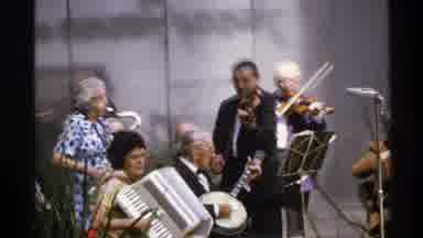 ISLE ROYALE MICHIGAN-1972: A Group Of Musicians Playing Instruments In A Park